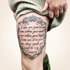 Eminem Lyrics in Ornate Frame Thigh Tattoo Design Inkbulb