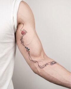 Minimalist Infinity Vine with Galaxy Arm Tattoo Design Inkbulb