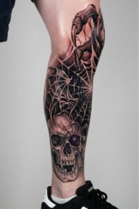 Web Skull Leg Tattoo Design Inkbulb